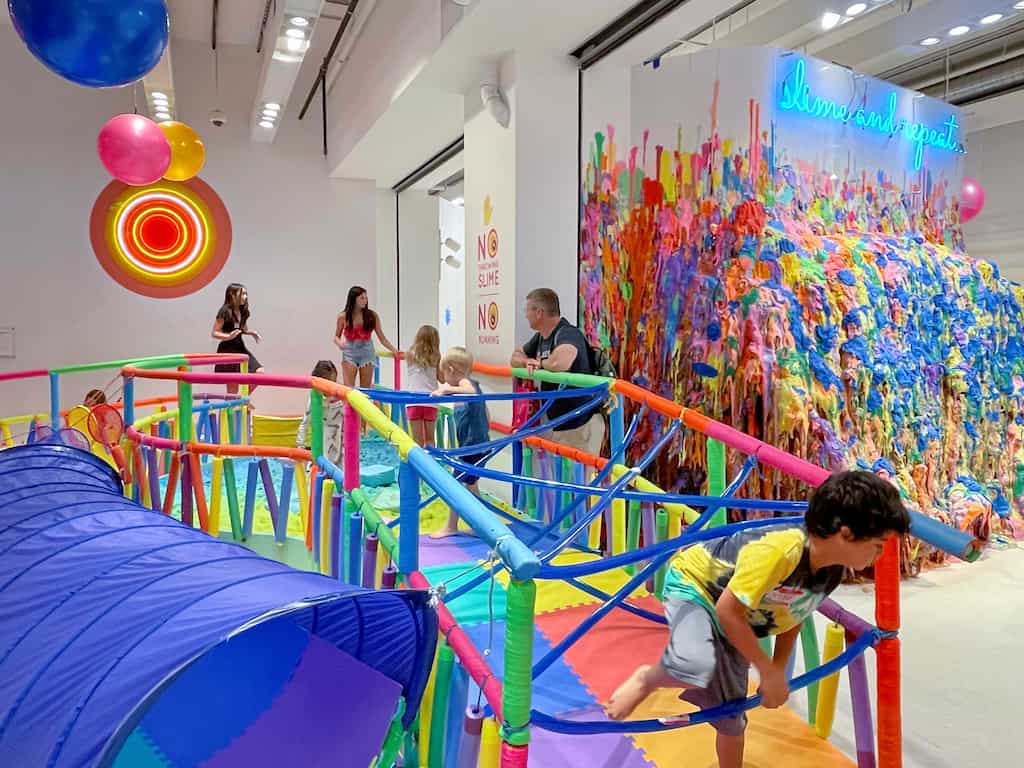 Children play with slime at the Sloomoo institute in New York