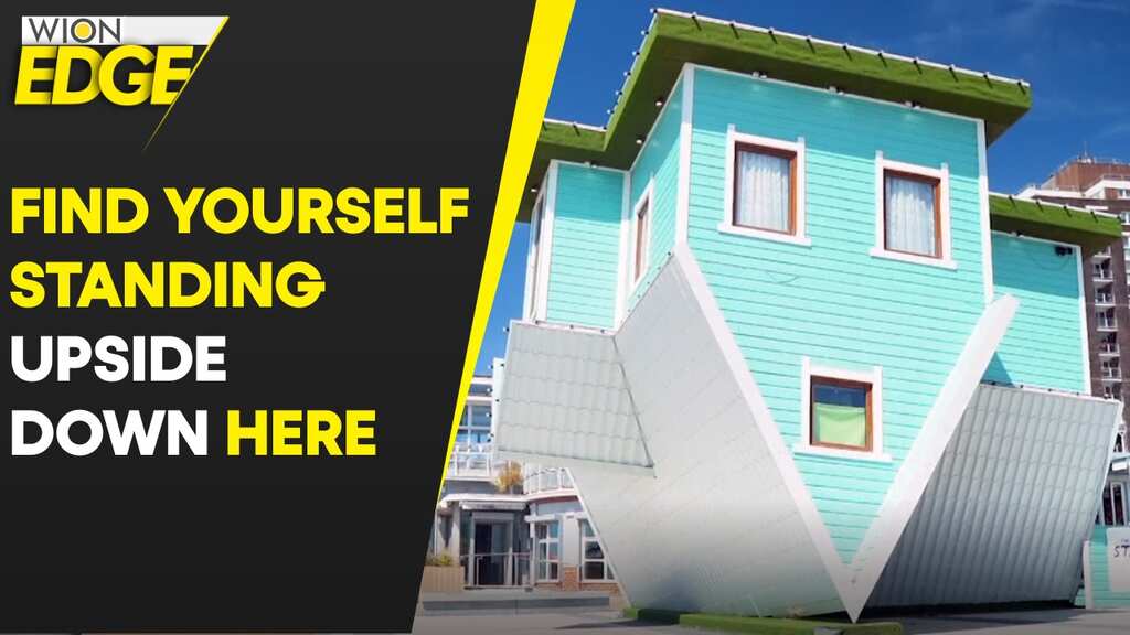 In this seaside house, people appear upside down