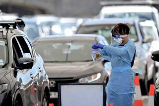 Australia registers record number of COVID-19 cases as Omicron surges