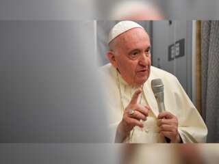 Pope Francis says he may cut down on travel