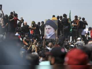 Al-Sadr supporters protest in Baghdad; protesters breach concrete barricades