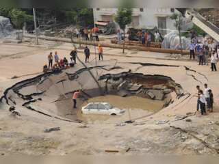 In pics: Bizarre enormous sinkholes appear in the middle of nowhere