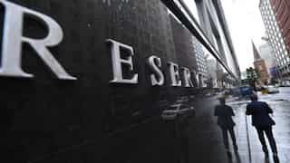 Australia's central bank cautions households against over-borrowing when interest rates decline