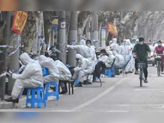 Authorities race to contain Covid-19 surge, eligible travellers leave Hainan