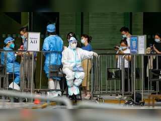 China battles Covid outbreaks in tourism hubs