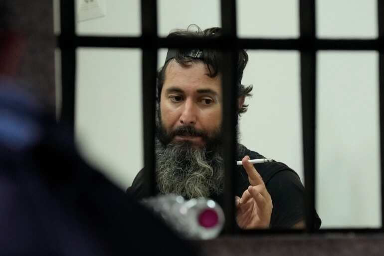 Armed man who held bank staff hostage to withdraw savings becomes hero in Lebanon