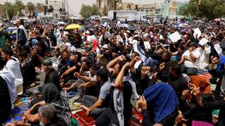 Sadr followers hold mass prayer outside Iraqi parliament in show of force