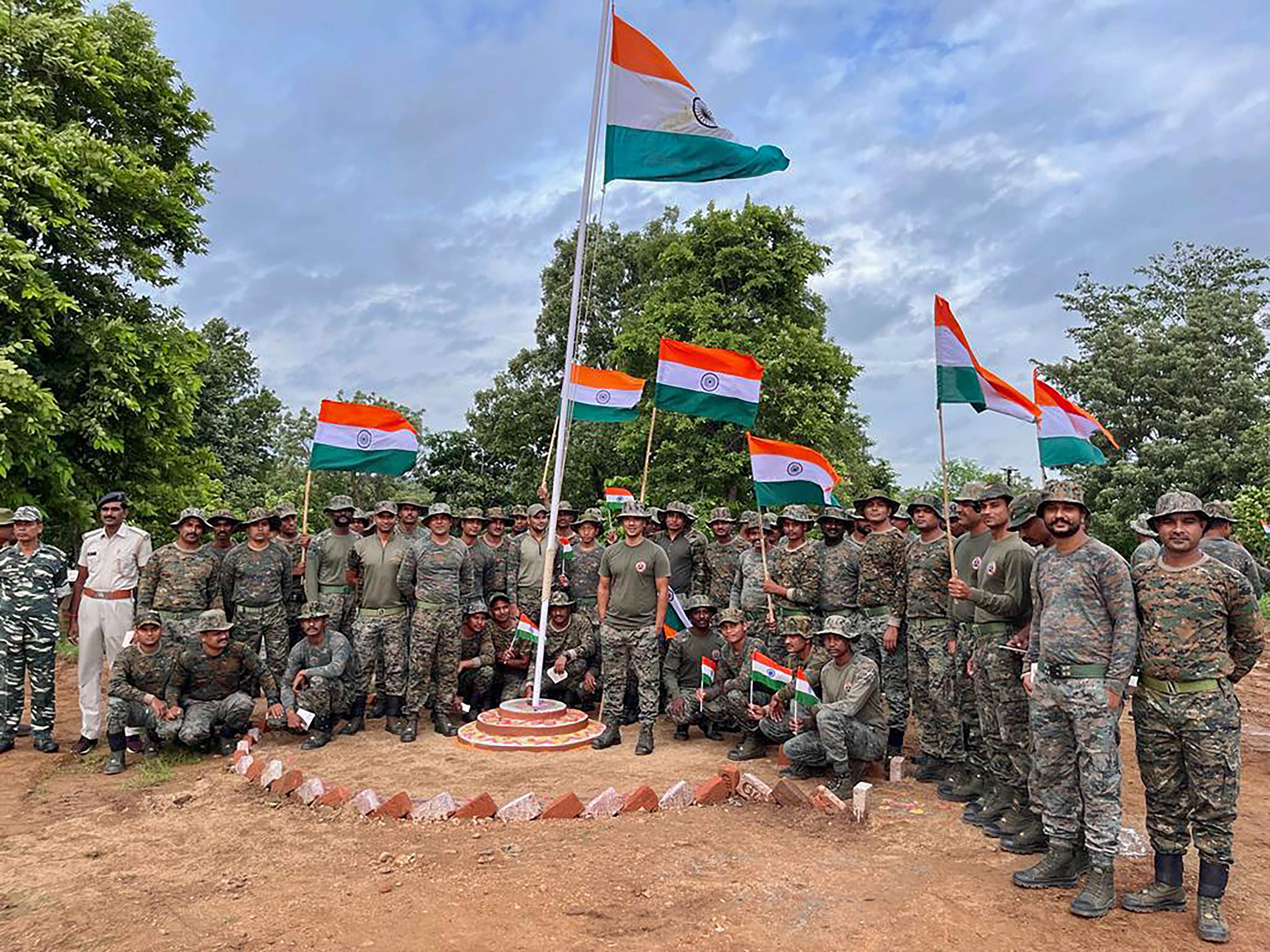 CRPF personnel hoist the national flag