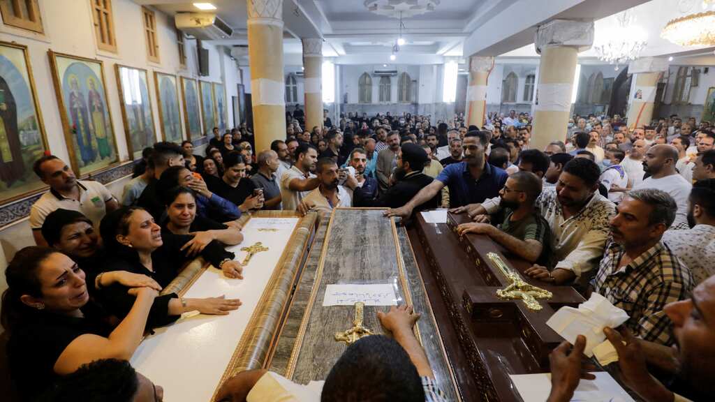 Triplets and twins among 15 children killed in electrical fire that swept through Egyptian church