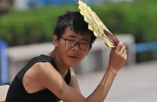 Amid record heatwave, Chinese planes shoot rods into the sky to induce rain