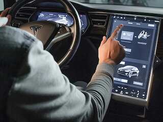 Tesla's biggest problem is its fan club; owner implants car keys in hand