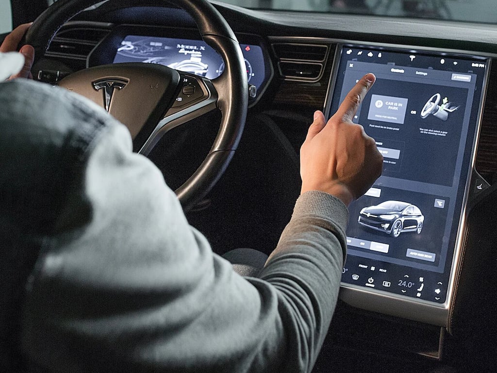 Tesla's biggest problem is its fan club; owner implants car keys in hand