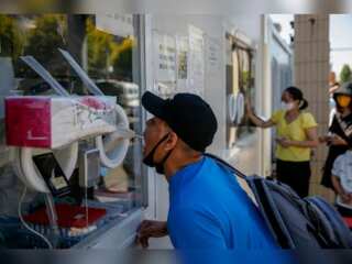 Big cities ramp up Covid curbs in China