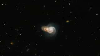 Hubble clicks brilliant photo of two 'overlapping' spiral galaxies