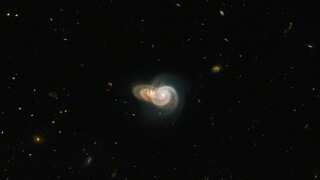 Hubble clicks brilliant photo of two 'overlapping' spiral galaxies