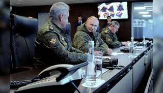 Russian President Vladimir Putin attends military exercises with Chinese forces