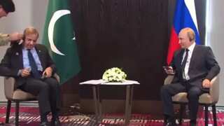 Pakistan PM Sharif's struggle with his earphones leaves Putin amused at the SCO