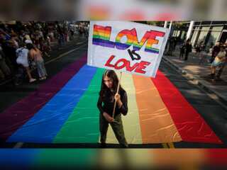Serbia holds pride march; protesters hurl stones, stun grenades at police