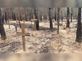 Ukrainians search for their dead relatives at Izium grave site