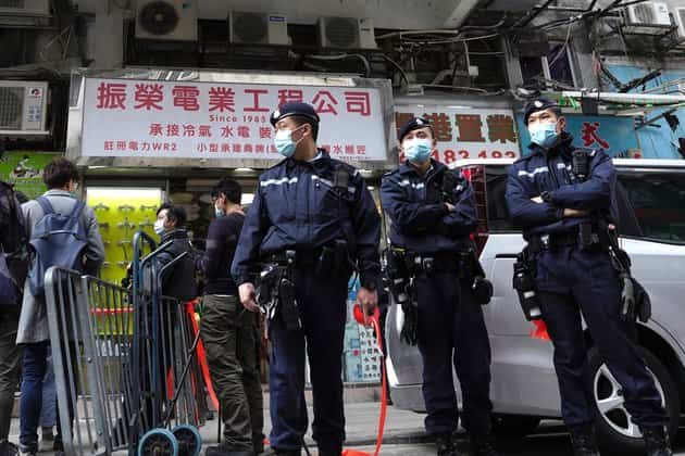 Hong Kong charges harmonica player with sedition law at Queen vigil