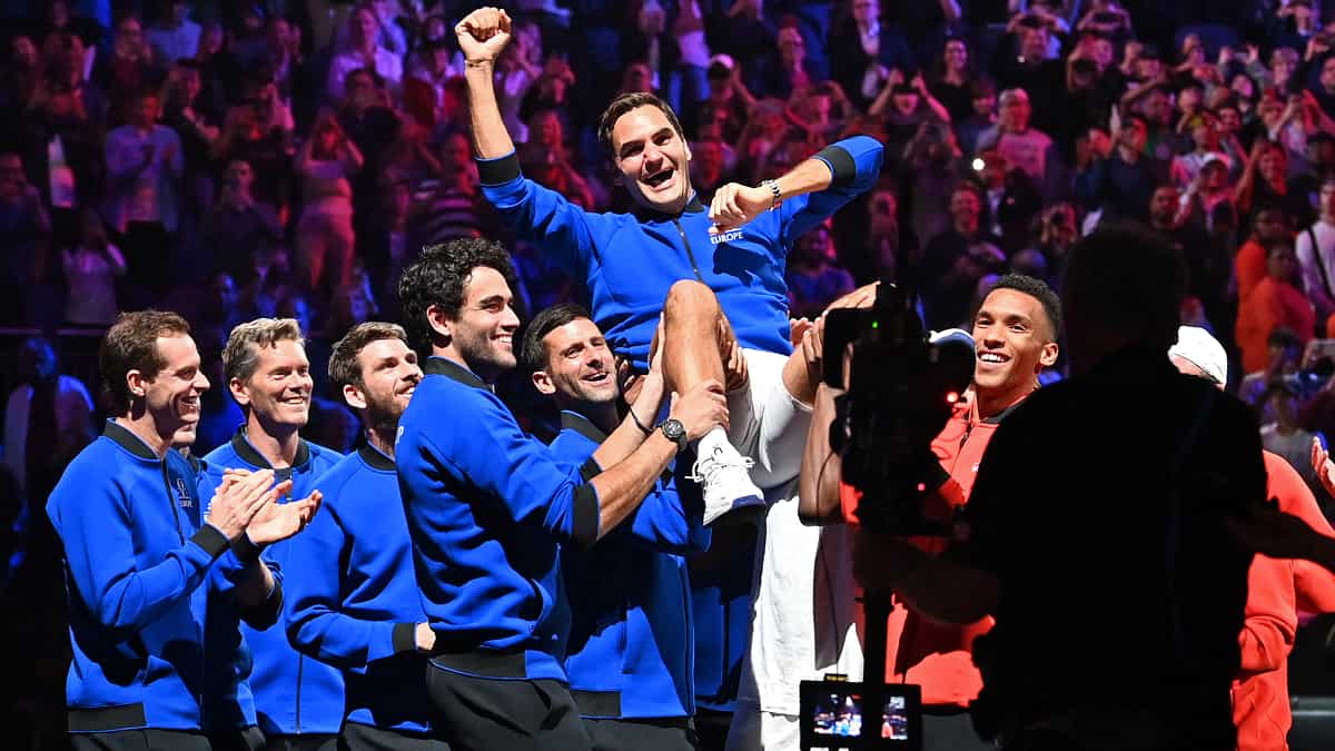 Roger Federer lifted by his teammates