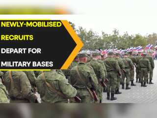 Recruits wave goodbye to their family in Crimea as they depart for military bases