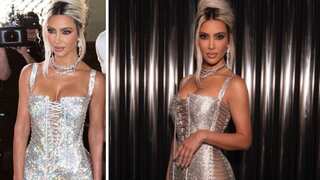 Watch: Kim Kardashian is barely able to walk in her new shimmer D&G dress