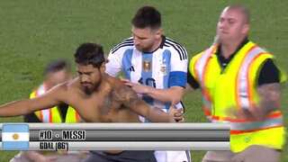 WATCH: Lionel Messi nearly taken down by security as he tries to sign pitch invader's bare back in USA
