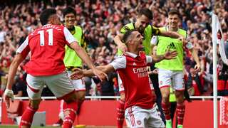 Arsenal beat Spurs to stay top, Liverpool held by Brighton