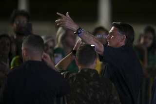 Brazil presidential election enters runoff as Bolsonaro beats expectations to finish a close second to Silva
