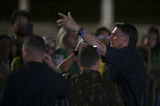 Brazil presidential election enters runoff as Bolsonaro beats expectations to finish a close second to Silva