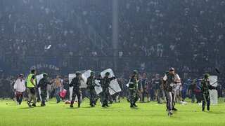 32 children among 125 dead, nine police officers suspended after Indonesia stadium disaster