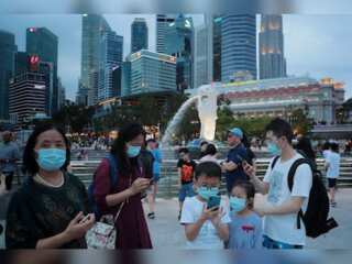 Singapore to ease more Covid curbs, step up vaccination program