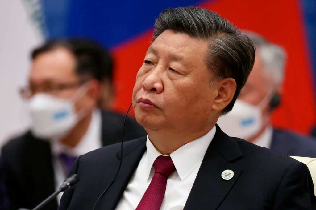 China vows to not renounce use of power, Xi says will ensure Taiwan reunification with mainland