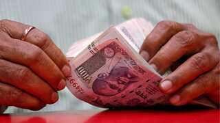 Indian rupee falls to a record low of 83.06 against the US dollar