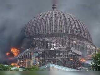 Giant dome collapses as fire engulfs mosque in Indonesia