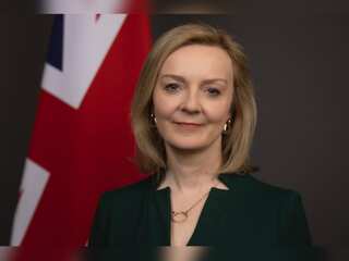 Liz Truss vows to stay, but is on brink as Home Secretary quits