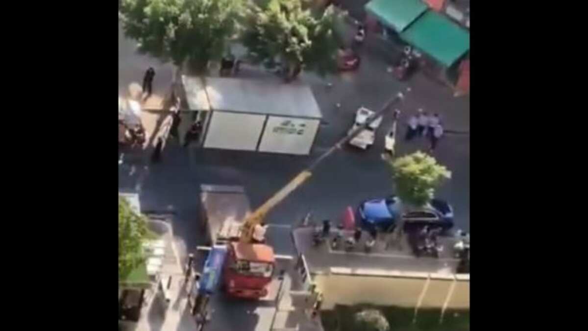 Too much distancing: Video shows Covid patient being lifted using crane, watch Too much distancing: Video shows Covid patient being lifted using crane, watch