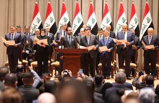Iraq parliament approves new government after year of deadlock