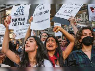 Angry protesters target scholars & clerics as Iranians adopt a new symbol of protest