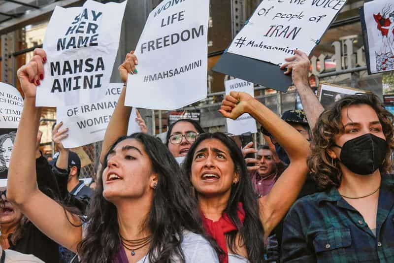 Angry protesters target scholars & clerics as Iranians adopt a new symbol of protest
