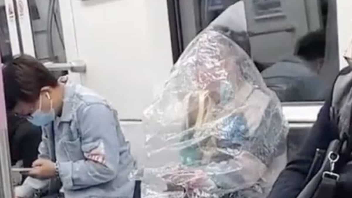 Chinese woman on train wraps herself in plastic bag to eat banana, leaves netizens bemused Chinese woman on train wraps herself in plastic bag to eat banana, leaves netizens bemused