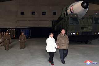 North Korean leader Kim Jong Un reveals daughter at missile test
