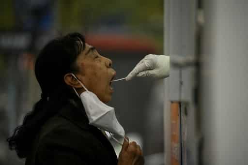 As China battles Covid with lockdowns and curbs, industrial profits drop