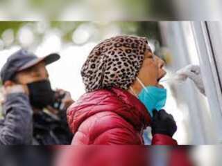 Covid cases hit China, Beijing districts shut schools and eateries