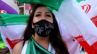 Iran: Bank manager sacked for providing service to woman without veil