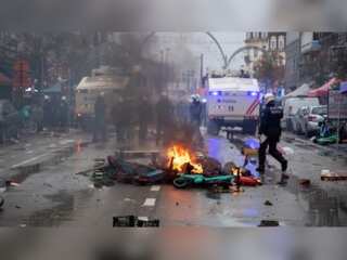 Watch: Belgian police fire water cannons & tear gas to disperse rioting football fans