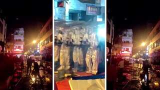 Covid protests escalate in China’s Guangzhou, hazmat-suited riot police clash with demonstrators