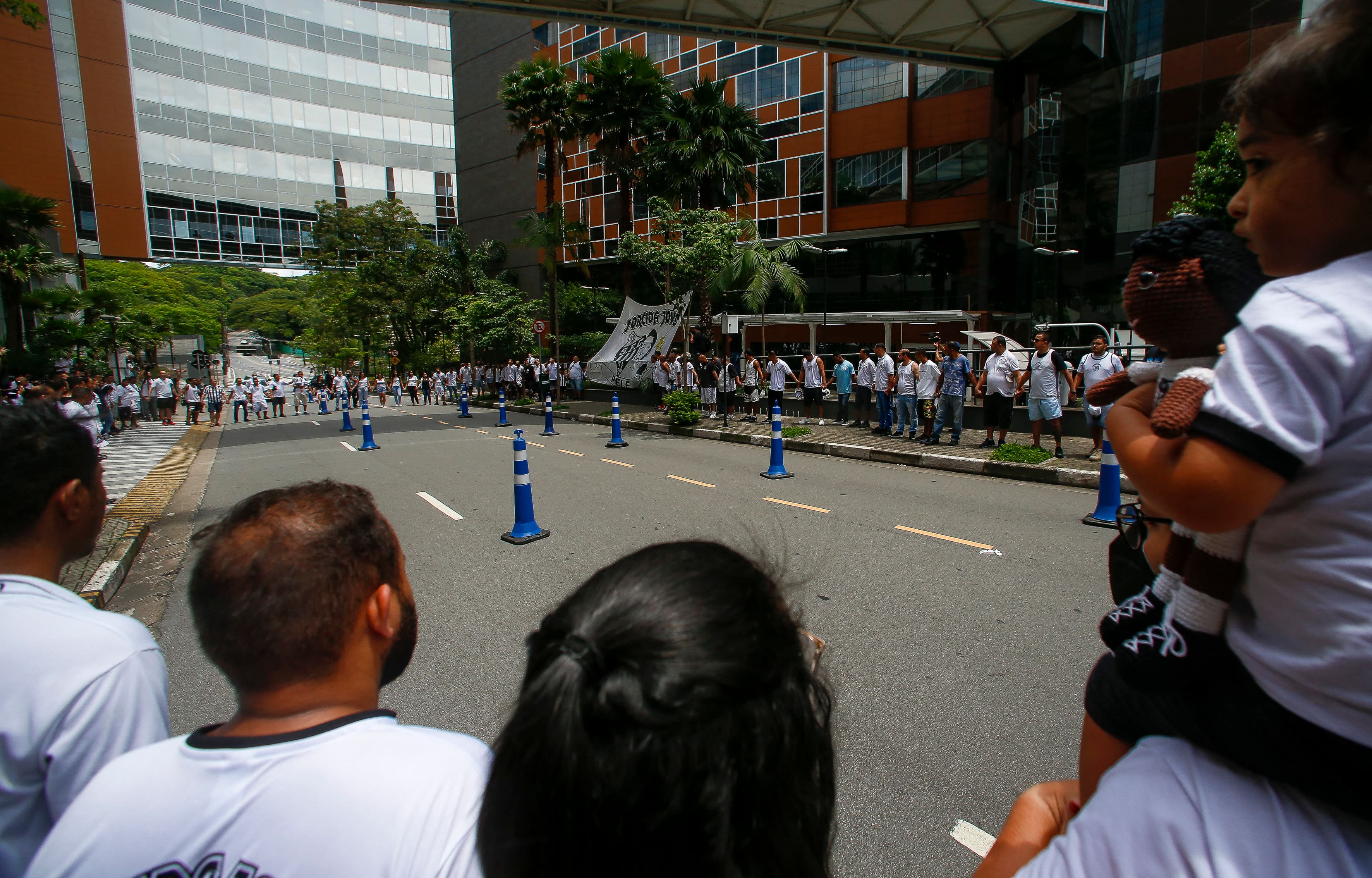 Fans attend a vigil outside the hospital