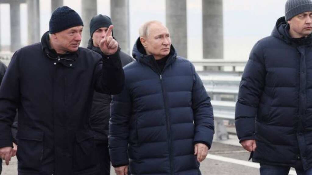 Putin walks along Crimean bridge destroyed as 'birthday gift' in October